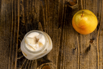 pear yogurt with pieces of fruit on the table