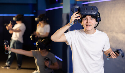 Portrait of a young man with a very surprised look, who took off her virtual reality glasses