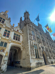 Brugge, Flanders, Belgium - June 25, 2024: Blinde Ezelstraat exit to Burg square, with vaulting...