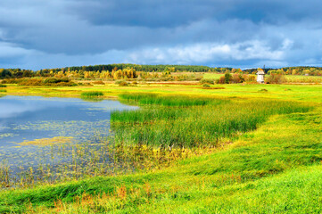 Autumn landscape - picturesque rural autumn landscape of the river valley and windmill in sunny...