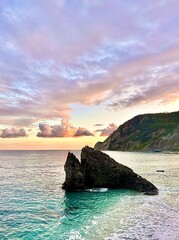 Naklejka premium Majestic Sunset Over the Waters of Monterosso, Cinque Terre, Italy