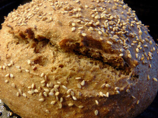 loaf of whole wheat bread with seeds on top