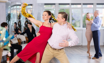 Adult couple dancing and practicing in dance class