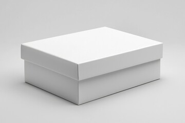 Fototapeta premium A White Cardboard Box on a Gray Surface