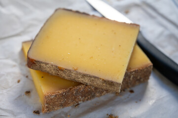 French cheese Comte, varieties unpasteurised ed milk Prestige, fruity flavoured Fruite and Vieille Reserve close up
