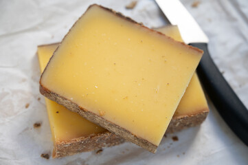 French cheese Comte, varieties unpasteurised ed milk Prestige, fruity flavoured Fruite and Vieille Reserve close up