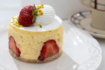 Red fruit sweet dessert cheesecake tart with fresh strawberries in bakery