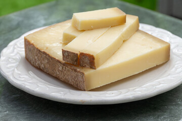 French cheese Comte, varieties unpasteurised ed milk Prestige, fruity flavoured Fruite and Vieille Reserve close up