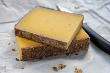 French cheese Comte, varieties unpasteurised ed milk Prestige, fruity flavoured Fruite and Vieille Reserve close up