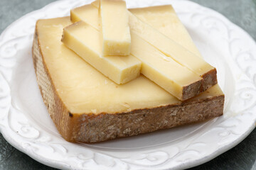 French cheese Comte, varieties unpasteurised ed milk Prestige, fruity flavoured Fruite and Vieille Reserve close up