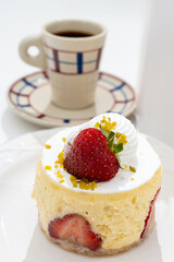 Red fruit sweet dessert cheesecake tart with fresh strawberries in bakery