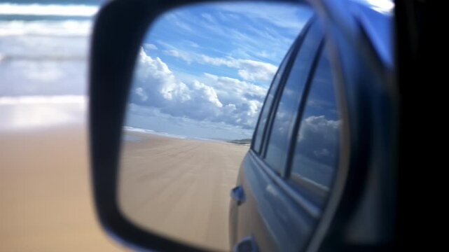 K'gari Fraser Island, Queensland, Australia- 4wd car driving on beautiful 75 mile beach on the east coast.