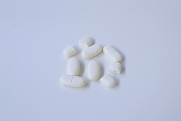 Group of tablet drugs on white background