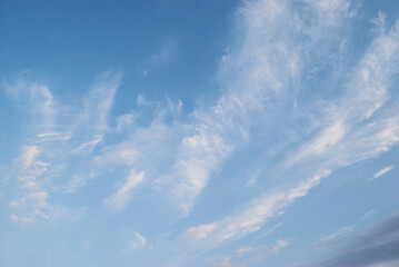 gentle white clouds in the blue sky