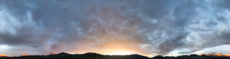 Breathtaking Mountain Landscape at Sunrise in Alberta, Canada with Dramatic Clouds and Morning Light