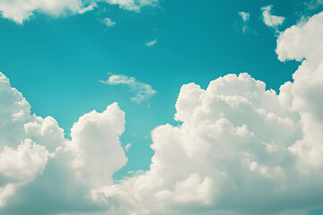 A bright blue sky filled with fluffy white clouds, creating a serene and peaceful atmosphere.