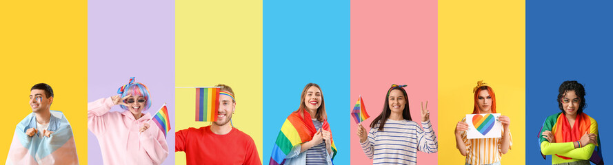 Group of young LGBT people with flags on color background