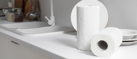 Rolls of paper towels on counter in kitchen, closeup