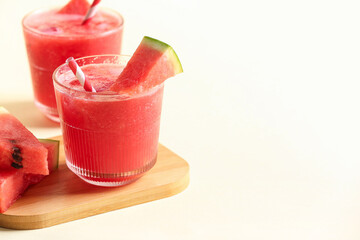 Glasses of tasty watermelon fresh on yellow background