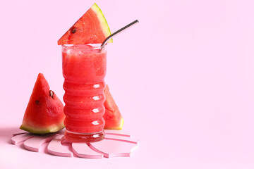 Glass of tasty watermelon fresh on pink background