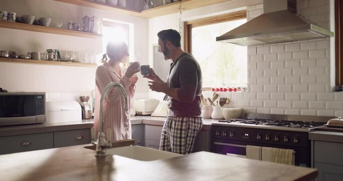 Couple, man or woman and coffee in kitchen for morning breakfast, caffeine or wellness in home with pajamas. People, espresso or hot beverage on weekend for peace, relax and bonding with love or care