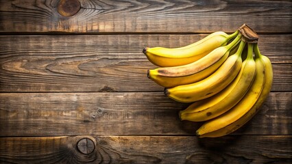 Fresh ripe bananas on rustic wooden background