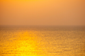 Fototapeta premium Blur Beautiful colorful dramatic sky on sea with clouds at sunset or sunrise