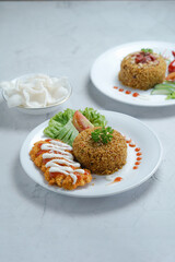 A Plate of Nasi Goreng With Chicken Katsu and Vegetables on Marble Table