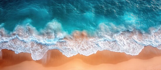 Aerial View of Turquoise Water Crashing on Sandy Beach
