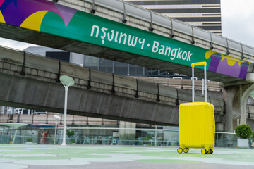 Obraz premium The suitcases in Sky walk of MBK Shopping Center.Famous destinations in Bangkok,Thailand, Landmark Tourism advertising logo on BTS sky train track, Thai word translation : Bangkok, vacation concept.