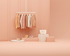 Peach fuzz is trend color of the year 2024. Autumn Clothes hanging on a rack with pastel orange background. Coat, sweater, warm shirt hanging on the hangers. Creative composition. Sale concept	
