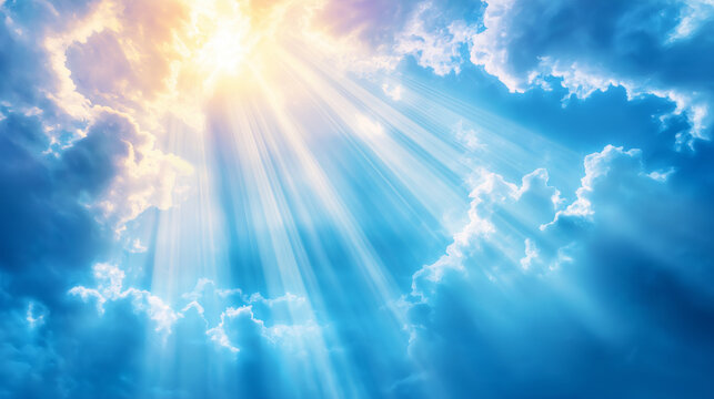 A beautiful blue sky with sun rays illuminating the clouds from behind.