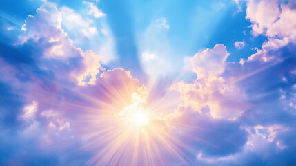 A beautiful blue sky with sun rays illuminating the clouds from behind.