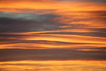 Red orange sunset clouds in sky wyoming