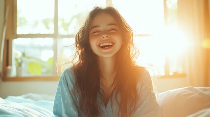 A joyful young woman smiles brightly in a sunlit room, radiating happiness and warmth. Perfect for lifestyle and positivity themes.