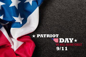 Patriot Day We Will Never Forget inscription inscription with USA flag on black textured background. Patriot Day.