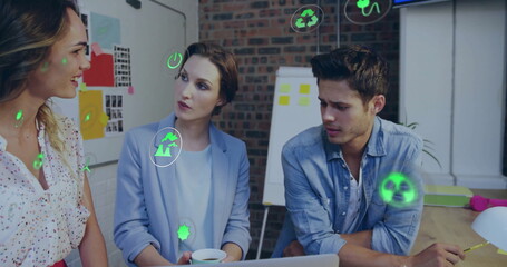 Image of eco icons and data processing over diverse business people in office
