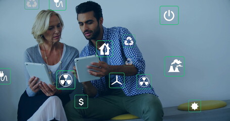 Image of eco icons and data processing over diverse business people in office