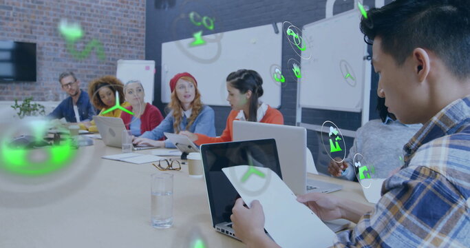Image of eco icons and data processing over diverse business people in office