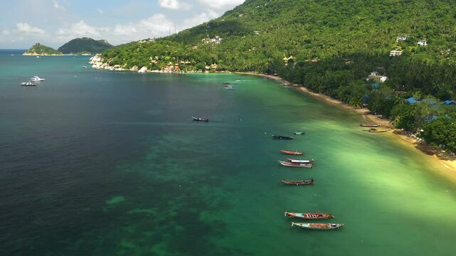 Aerial view over fishing boats on the coast of the Koh Tao, in sunny Thailand