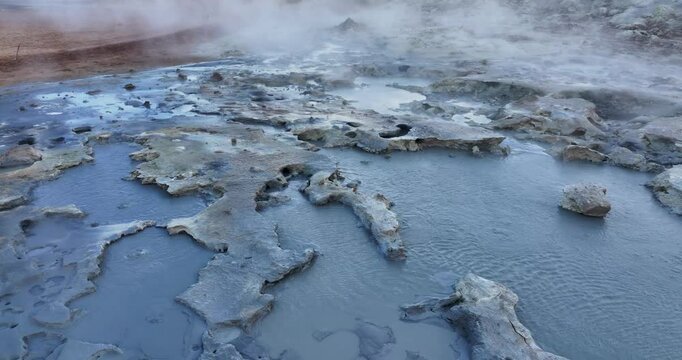 Located in Iceland's M&yacute;vatn region, there is a video showcasing a small smoking fumarole encircled by a variety of colorful sulphur crystals.
