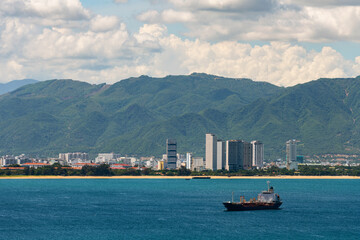 The sea bay and the Vietnamese city of Nha Trang on a sunny cloudy day