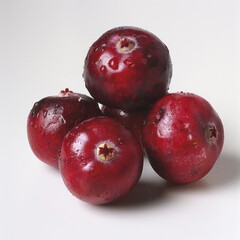 Obraz premium Several fresh, purple fruits piled neatly on a white surface