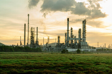 Oil refinery industry at sunset - factory - petrochemical plant