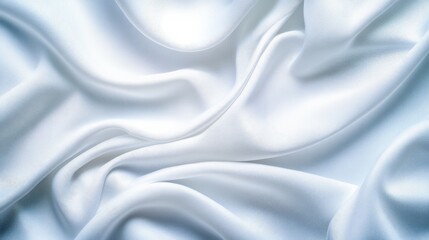 Fototapeta premium Elegant flowing white silk fabric background with soft waves and folds, perfect for use in fashion, design, and texture projects.