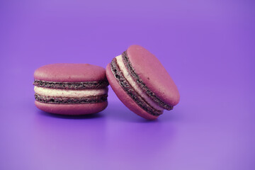 French macaroons over purple background