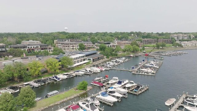 Drone view of botas docked at Downtown of Minnesota with lake minnetonka in USA.