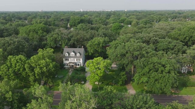 Moving aerial shot capturing suburb houses at Minnesota, USA during afternoon.