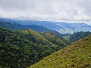 Fototapeta premium landscape with mountains and sky, Ta Nang Phan Dung forest, Vietnam