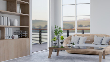 A modern, minimalist living room featuring a wicket sofa with pillows and a coffee table.